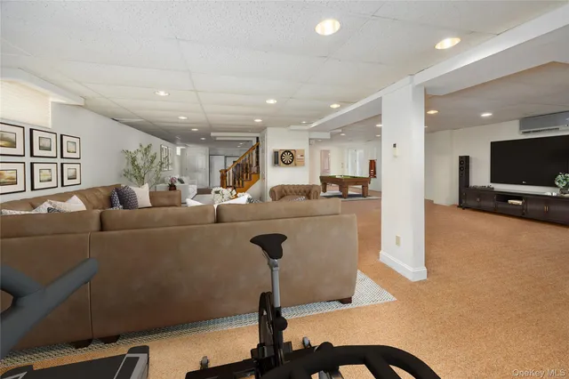 a spacious bedroom with a bed and a potted plant