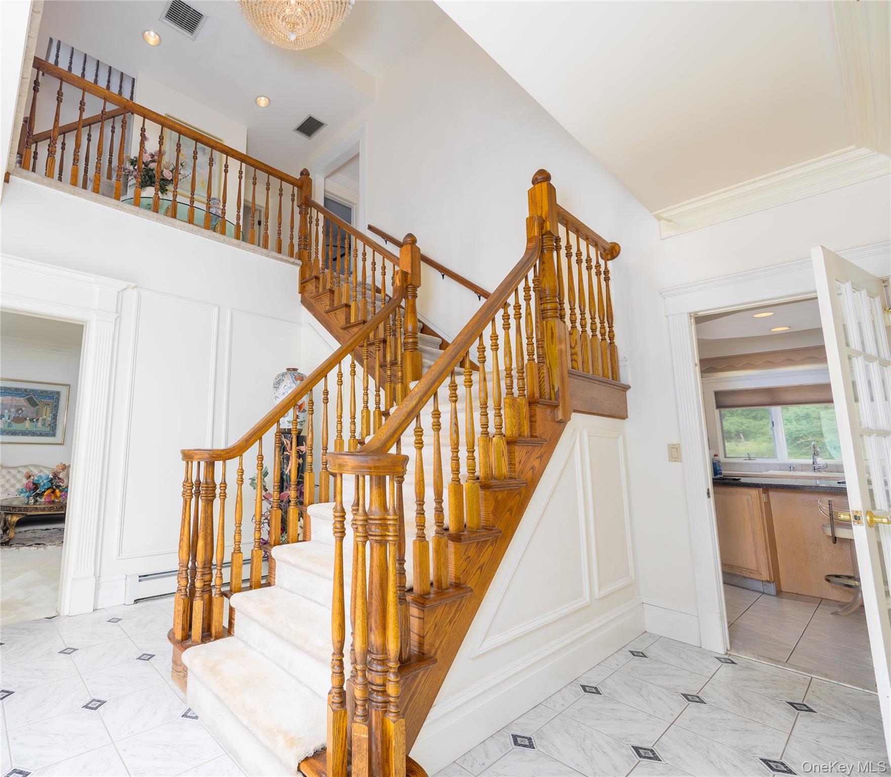 219 Maple Avenue Monroe, NY 10950 - Photo 3 of 40 a view of staircase with lots of frames and couches