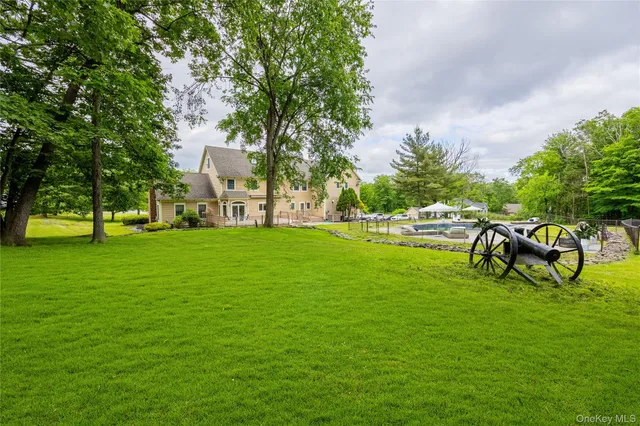 a aerial view of a house with swimming pool and porch