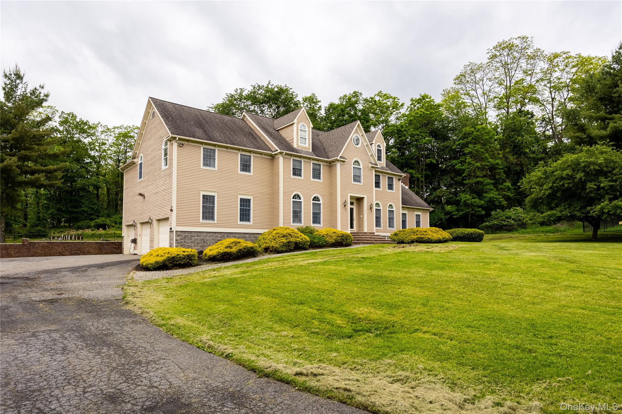 219 Maple Avenue Monroe, NY 10950 - Photo 36 of 40 a view of a house with a yard