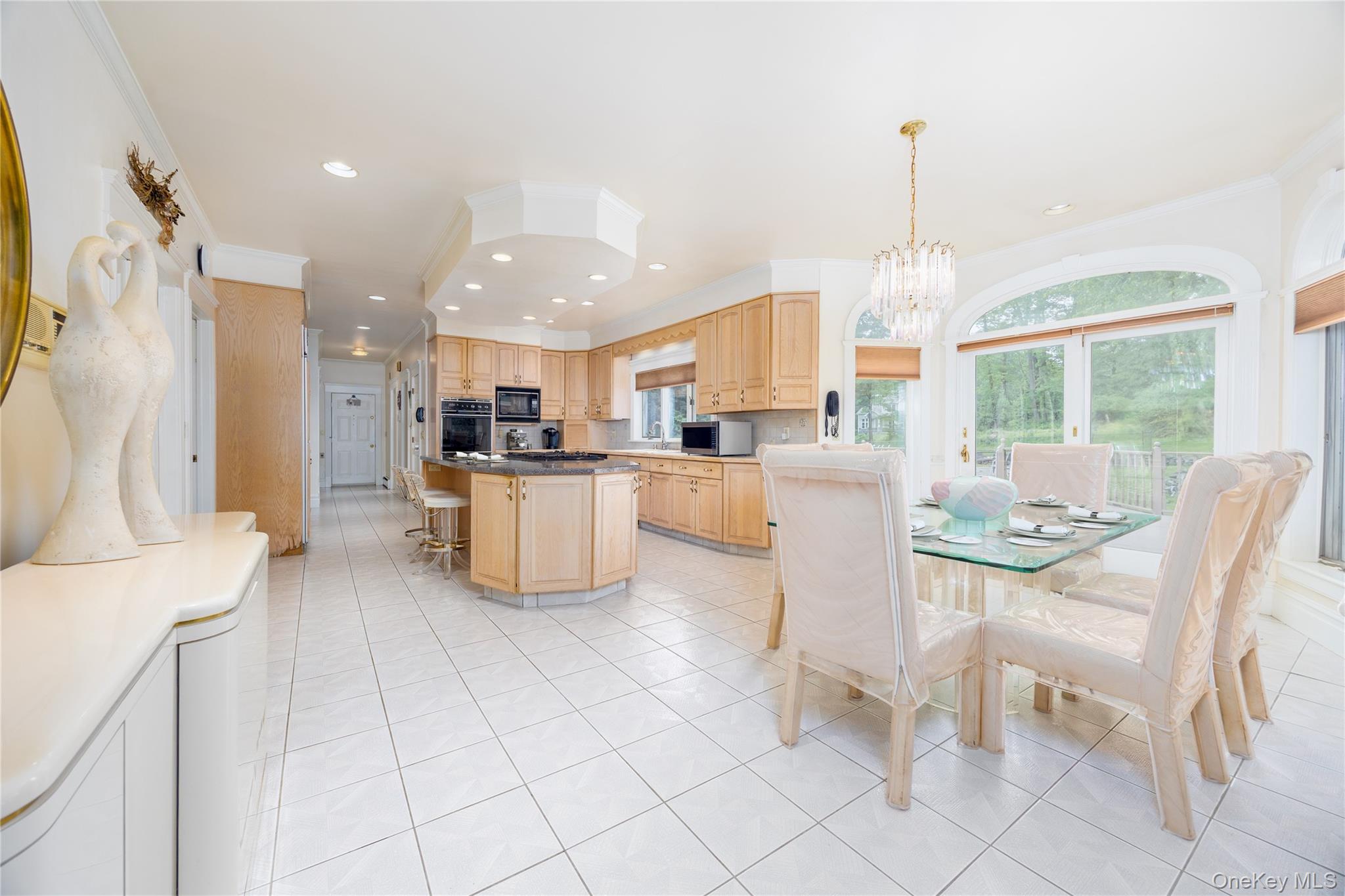 219 Maple Avenue Monroe, NY 10950 - Photo 8 of 40 a kitchen with stainless steel appliances kitchen island granite countertop a refrigerator and a view of living room