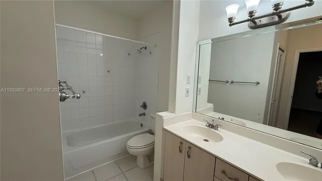 a bathroom with a sink toilet vanity and shower