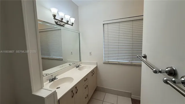 a bathroom with a sink and mirror