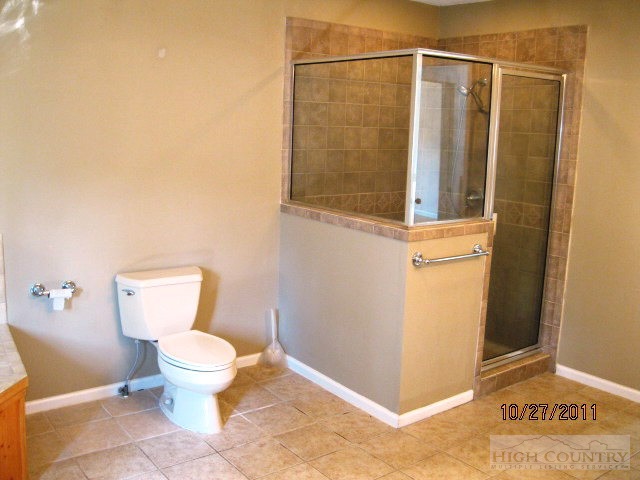 153 Alpine Court Boone, NC 28607 - Photo 4 of 13 a bathroom with a toilet and a shower