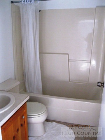 153 Alpine Court Boone, NC 28607 - Photo 6 of 13 a bathroom with a sink a toilet and shower
