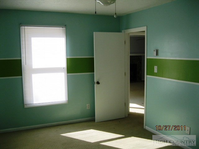 153 Alpine Court Boone, NC 28607 - Photo 7 of 13 a view of a room that has a window in it