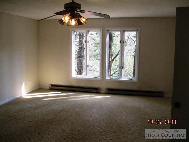 153 Alpine Court Boone, NC 28607 - Photo 9 of 13 a view of an empty room with a window