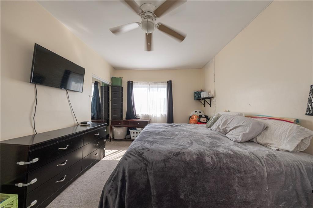 33 5th Street Pittsburgh, PA 15215 - Photo 16 of 43 a bedroom with a bed and a flat screen tv