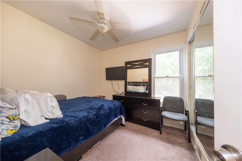 33 5th Street Pittsburgh, PA 15215 - Photo 19 of 43 a bedroom with bed and window