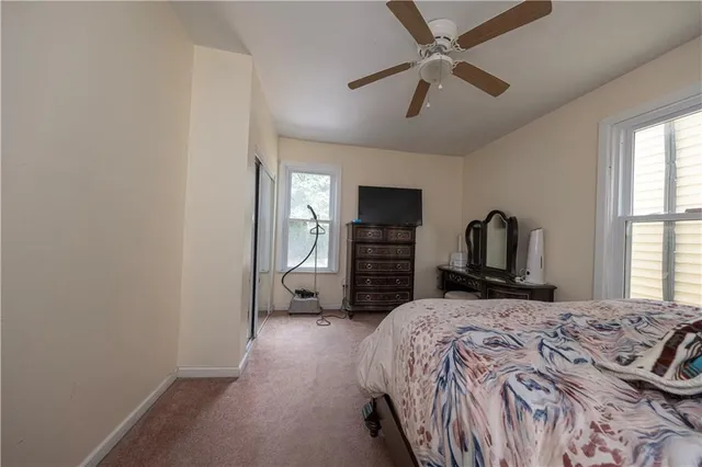 a bathroom with a double vanity sink a mirror and a bathtub