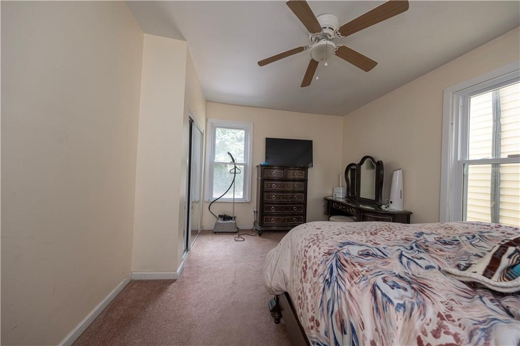 33 5th Street Pittsburgh, PA 15215 - Photo 21 of 43 a bedroom with a bed and a television