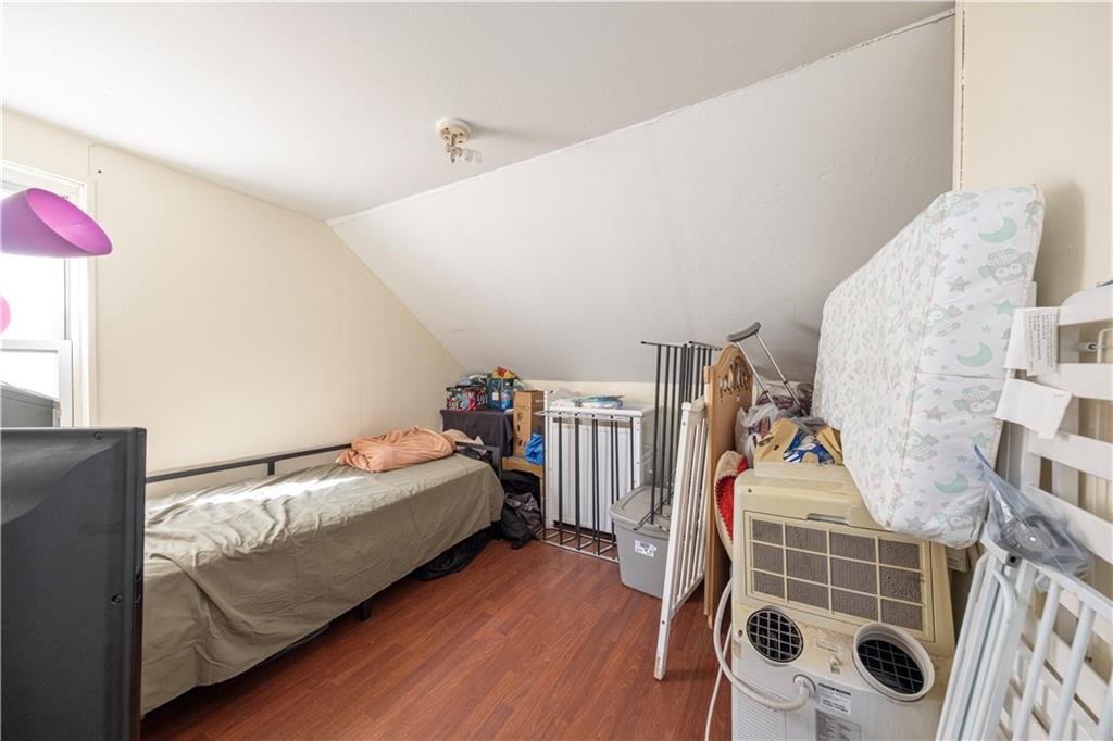 33 5th Street Pittsburgh, PA 15215 - Photo 28 of 43 a bed room with a bed and a chair