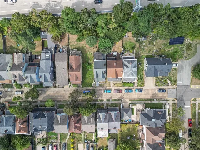an aerial view of a house with a lake view