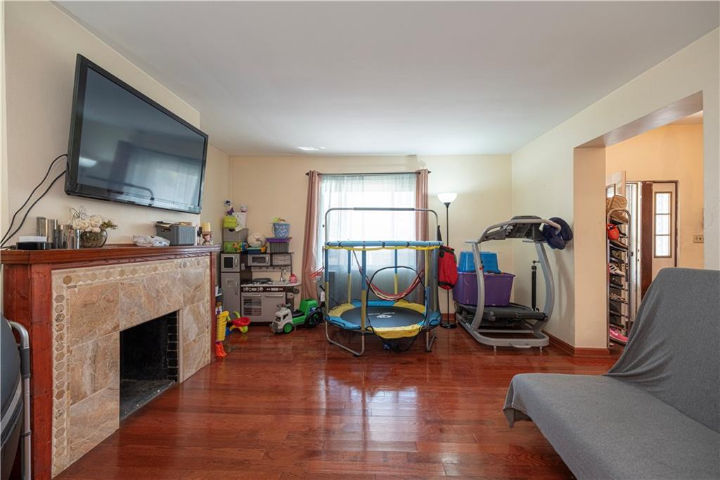 33 5th Street Pittsburgh, PA 15215 - Photo 5 of 43 a living room with furniture and a fireplace
