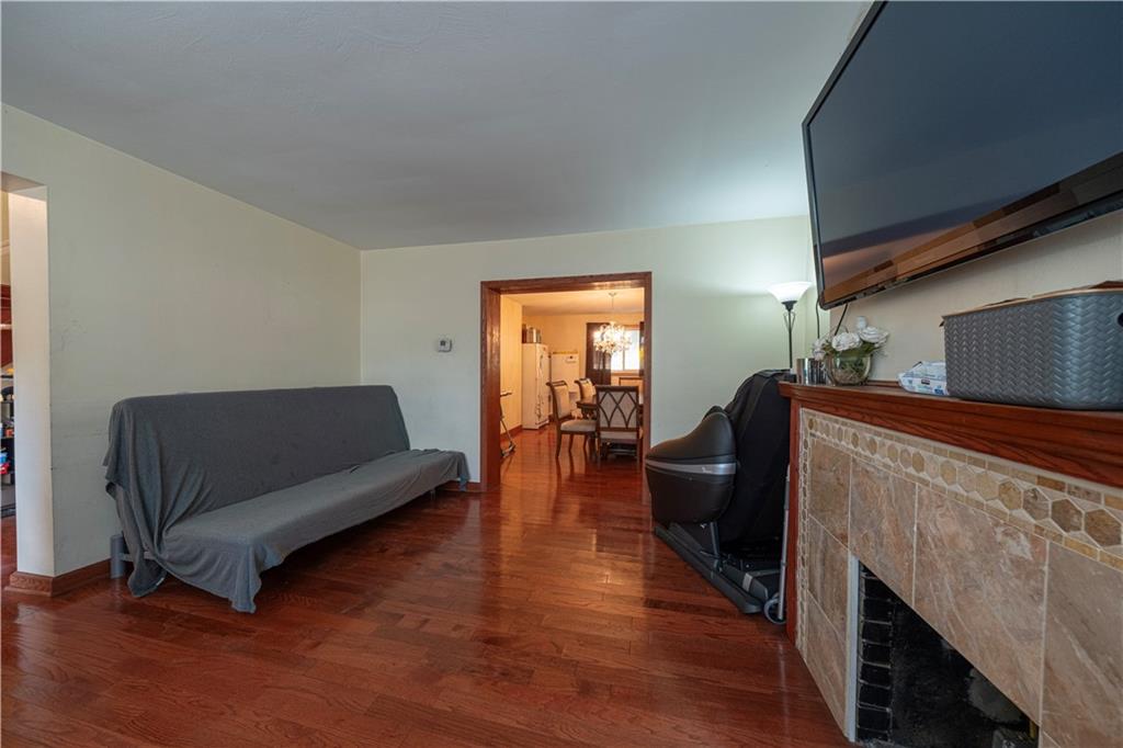 33 5th Street Pittsburgh, PA 15215 - Photo 6 of 43 a living room with furniture and a fireplace