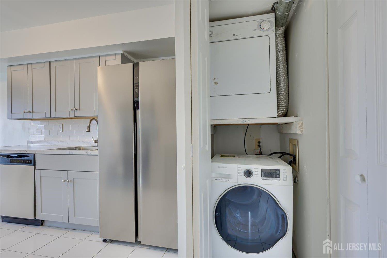 1607 Edison Glen Terrace Edison, NJ 08837 - Photo 9 of 19 a utility room with sink dryer and washer