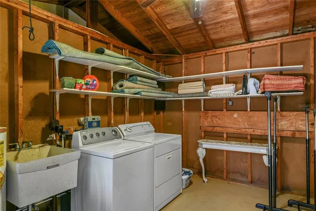 a view of a swimming pool with lawn chairs