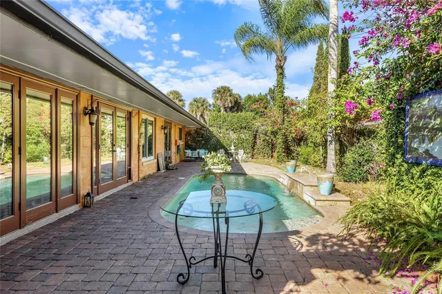 a view of a swimming pool with a sitting space