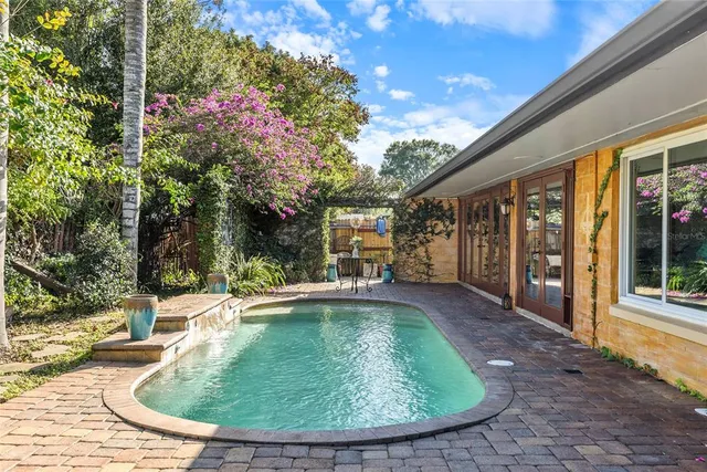 a view of a house with backyard porch and patio