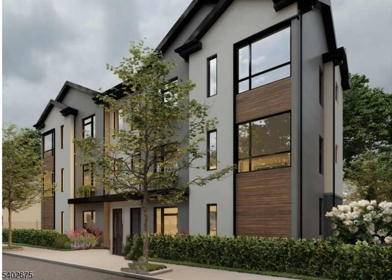 233 West Runyon Street Newark, NJ 07108 - Photo 2 of 4 front view of a house with a tree