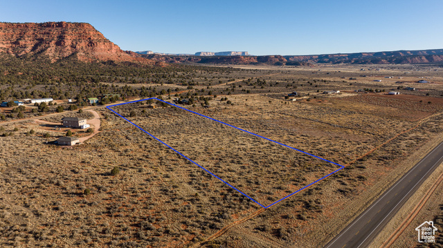 6026 East Zion Road Kanab, UT 84741 - Photo 2 of 27 Drone / aerial view featuring a mountain view