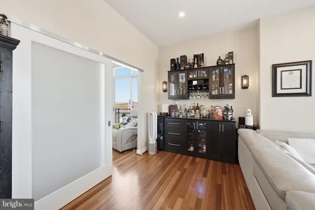 a room with a wooden floor and a sink