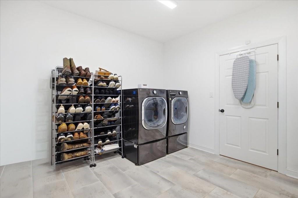 397 Thomas Road Dallas, GA 30132 - Photo 33 of 108 a view of a storage & utility room with washer and dryer