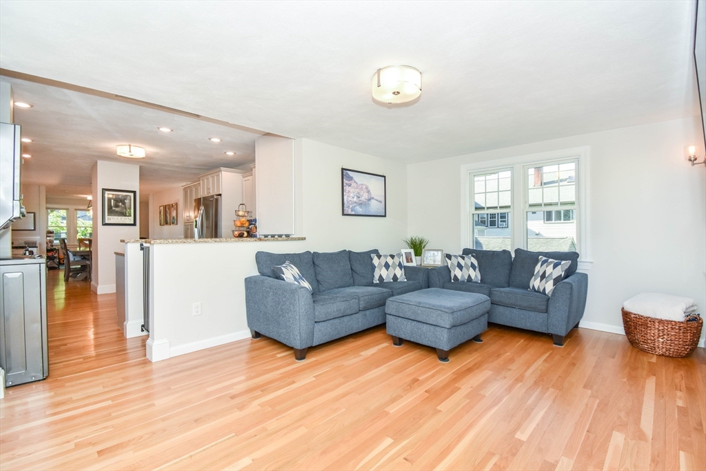 72 Evans Street, Unit 72 Watertown, MA 02472 - Photo 12 of 34 a living room with furniture and a wooden floor