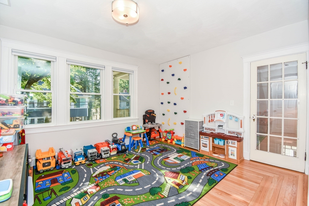 72 Evans Street, Unit 72 Watertown, MA 02472 - Photo 15 of 34 a very nice looking room with wooden floor and a large window
