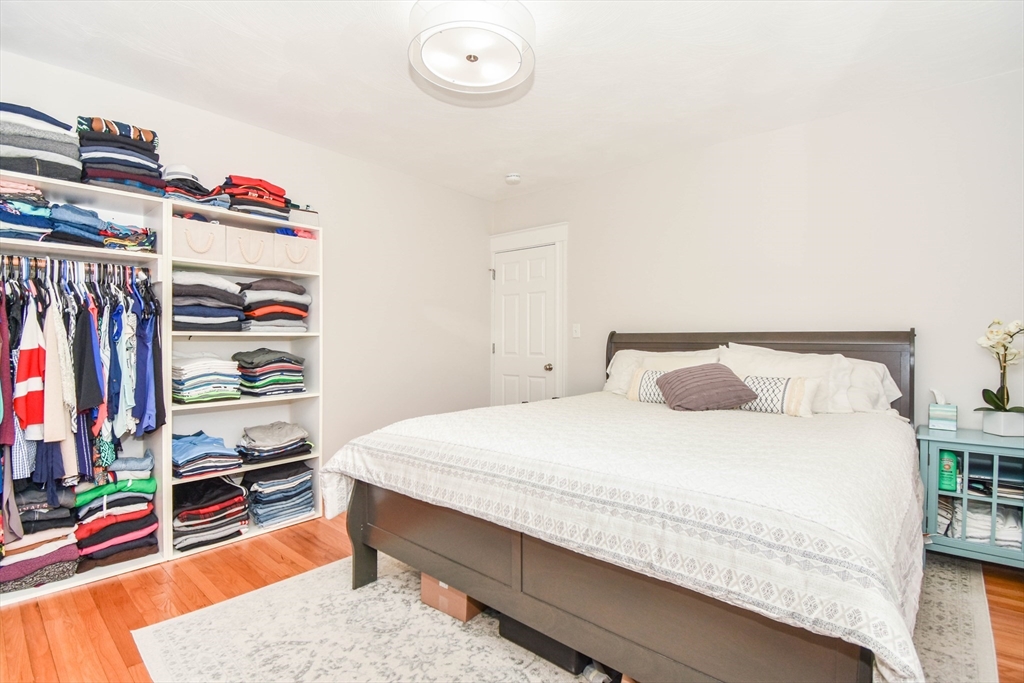 72 Evans Street, Unit 72 Watertown, MA 02472 - Photo 17 of 34 a bedroom with a bed and a window