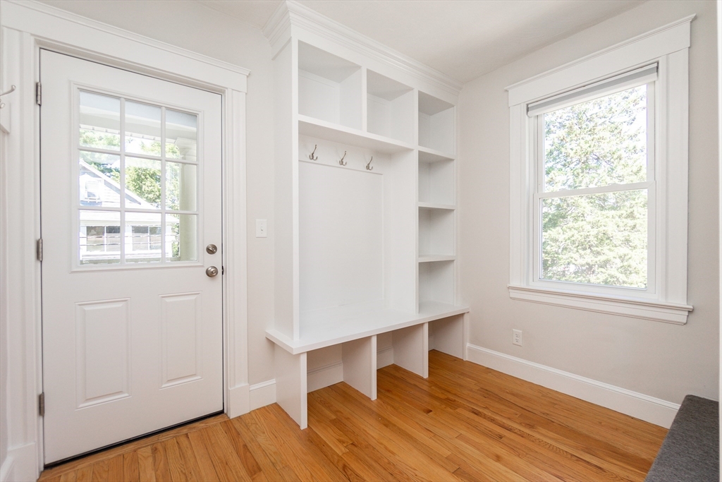 72 Evans Street, Unit 72 Watertown, MA 02472 - Photo 26 of 34 a view of an empty room with wooden floor and a window