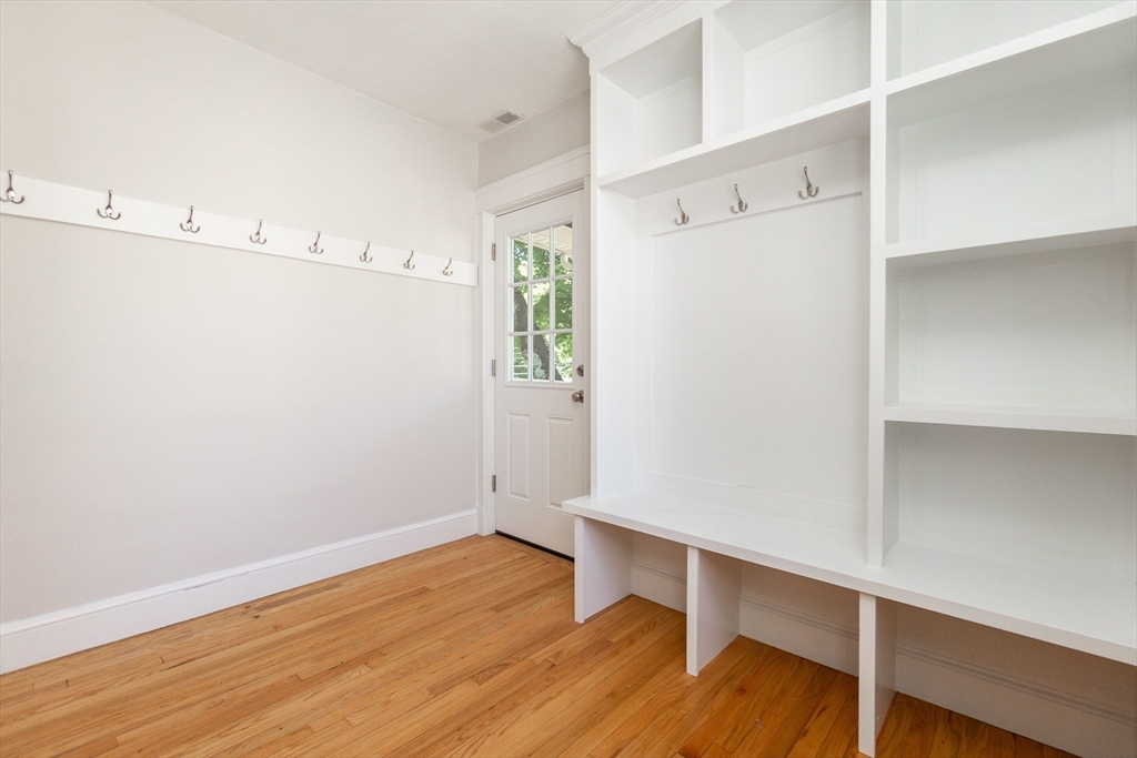 72 Evans Street, Unit 72 Watertown, MA 02472 - Photo 27 of 34 a view of an empty room with wooden floor
