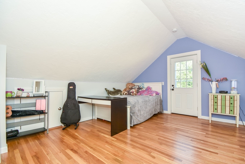 72 Evans Street, Unit 72 Watertown, MA 02472 - Photo 29 of 34 a living room with furniture and a wooden floor