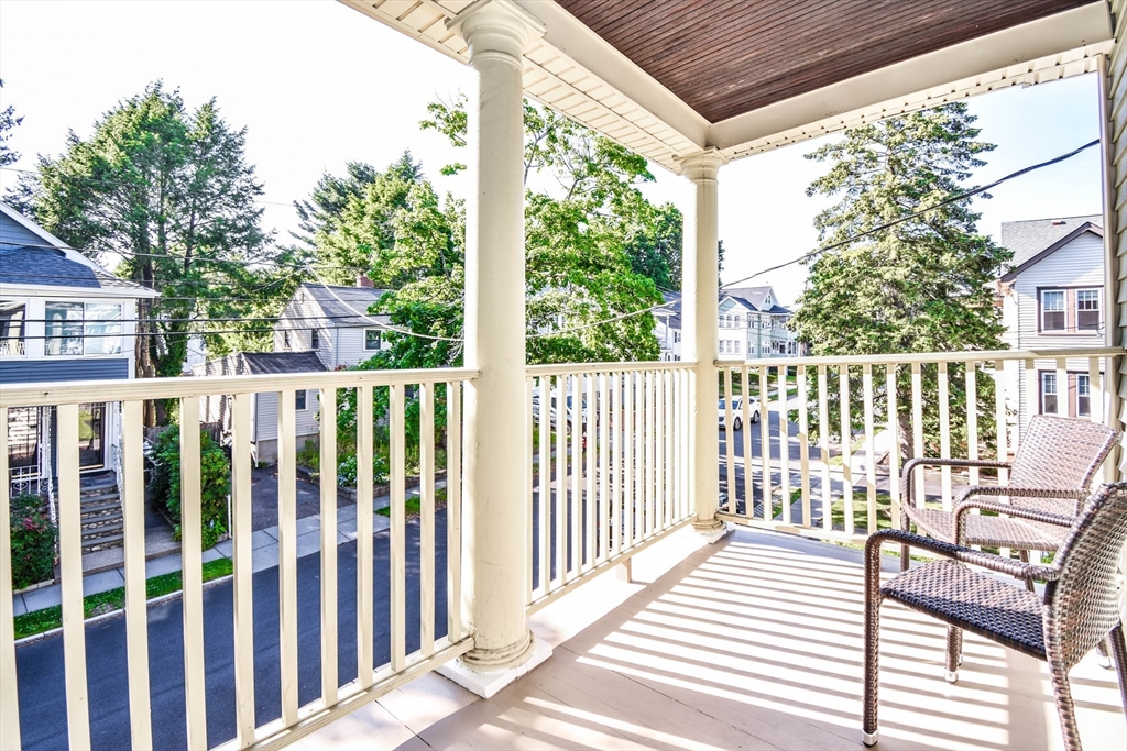 72 Evans Street, Unit 72 Watertown, MA 02472 - Photo 31 of 34 a view of a wooden chairs with a large window