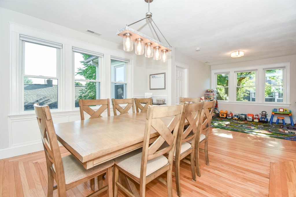 72 Evans Street, Unit 72 Watertown, MA 02472 - Photo 10 of 34 a view of a dining room and livingroom with furniture wooden floor a chandelier
