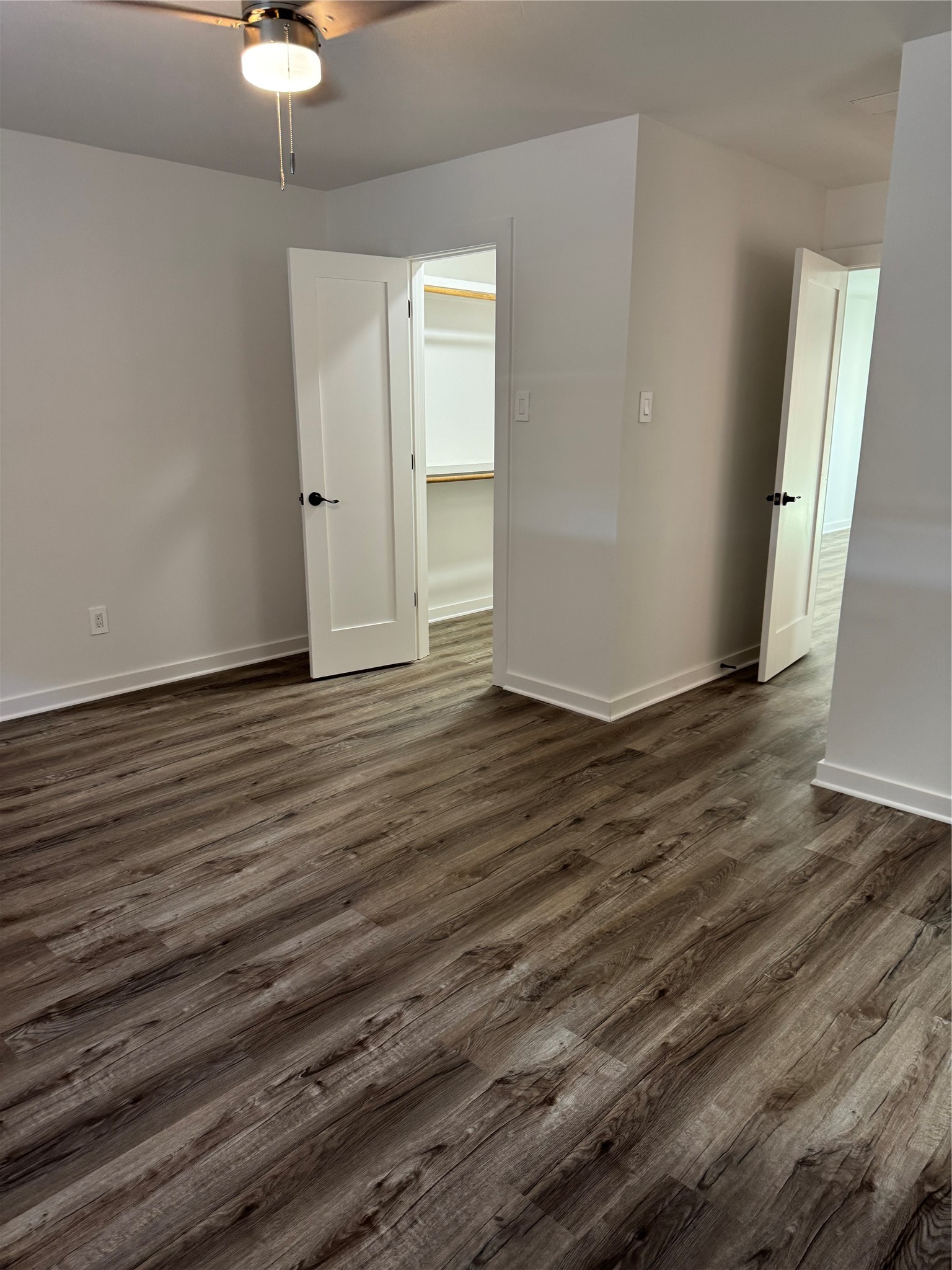4747 Allendale Road, Unit 49 Houston, TX 77017 - Photo 5 of 8 a view of an empty room with wooden floor and a chandelier