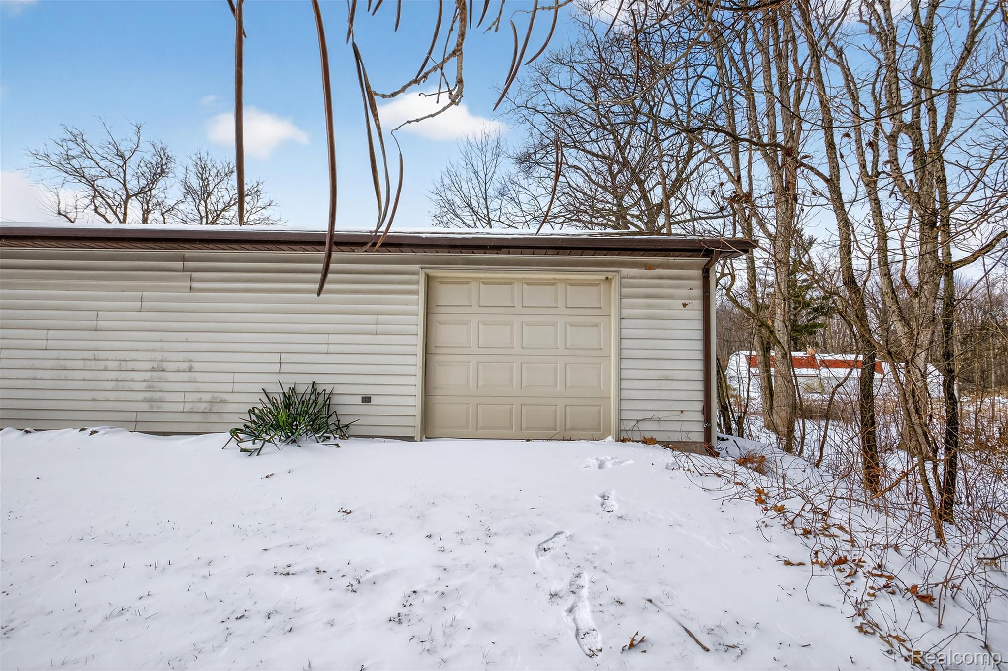 3241 Curtis Road Birch Run, MI 48415 - Photo 9 of 47 View of snow covered garage