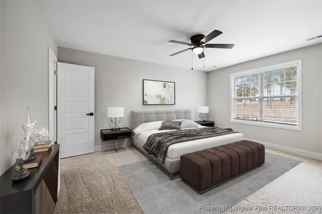 a bed room with a bed and a chandelier