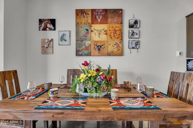 a kitchen with granite countertop kitchen island stainless steel appliances a stove a table and chairs