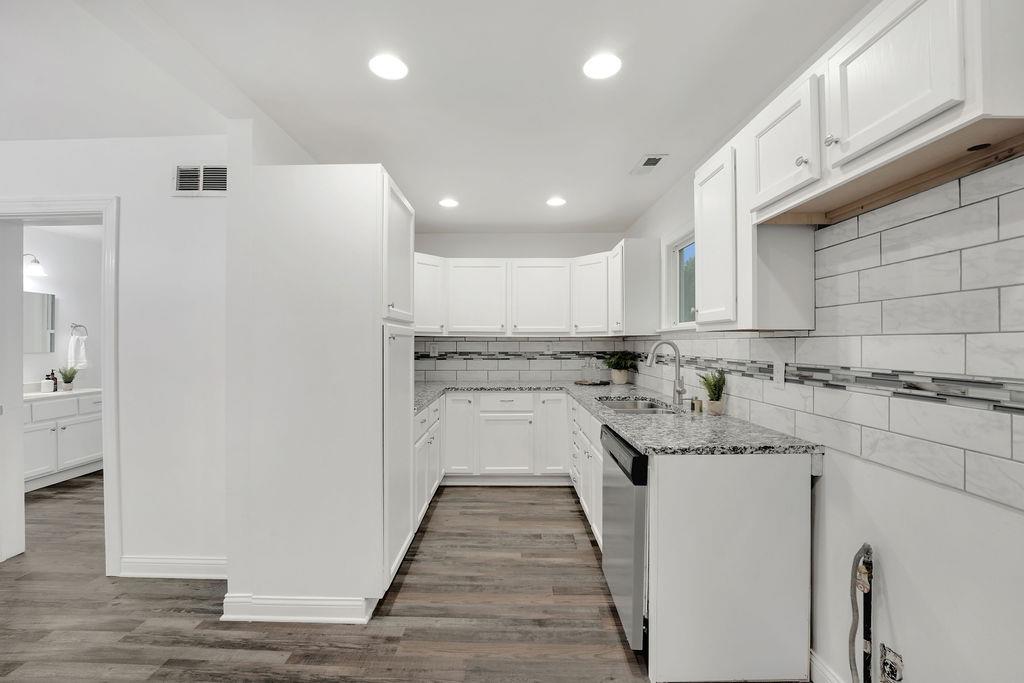 3714 Keck Place Gary, IN 46408 - Photo 11 of 24 a kitchen with granite countertop a sink and cabinets