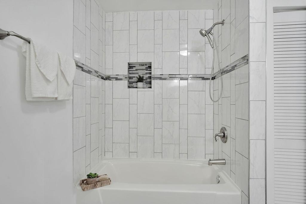 3714 Keck Place Gary, IN 46408 - Photo 16 of 24 a bathroom with a shower and a bath tub