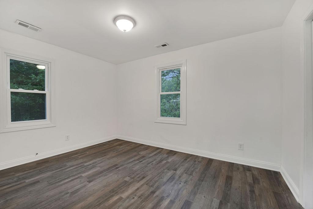 3714 Keck Place Gary, IN 46408 - Photo 20 of 24 an empty room with wooden floor and windows