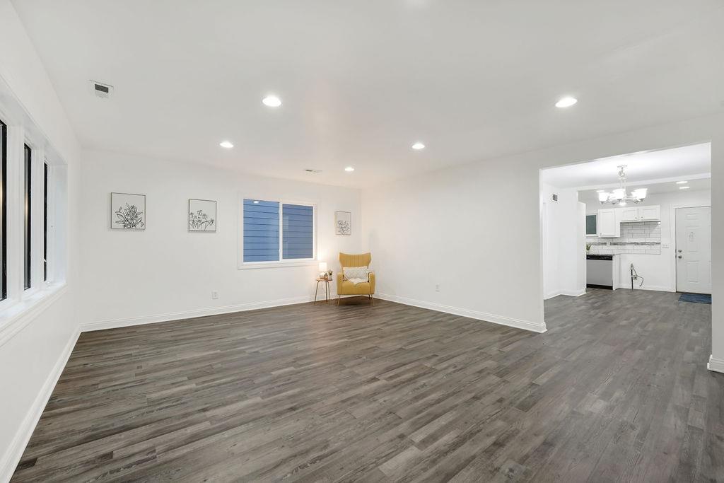 3714 Keck Place Gary, IN 46408 - Photo 5 of 24 a view of empty room with wooden floor and windows