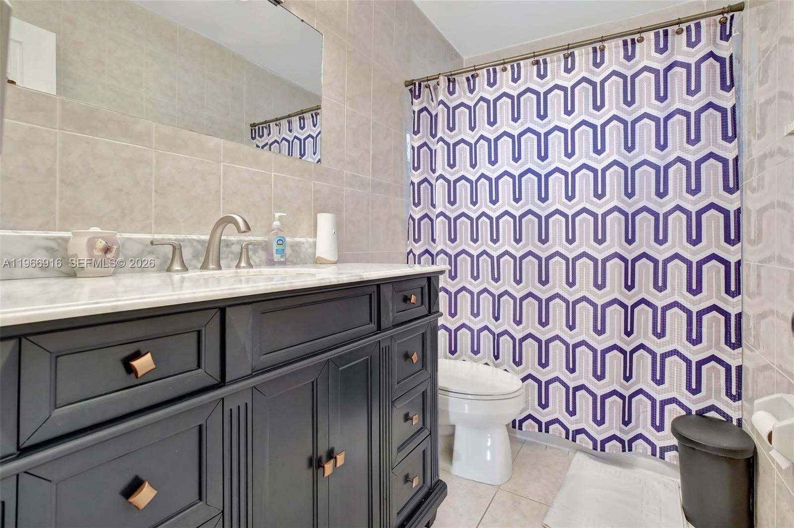 5300 Washington Street, Unit G127 Hollywood, FL 33021 - Photo 16 of 39 a bathroom with a sink and a mirror