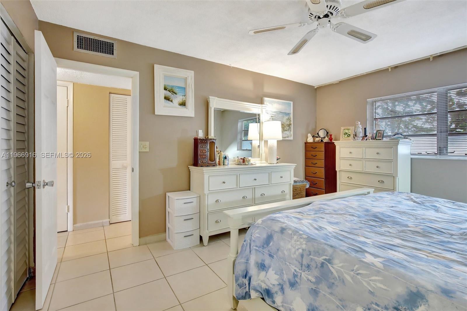 5300 Washington Street, Unit G127 Hollywood, FL 33021 - Photo 18 of 39 a room with a bed and a cabinets