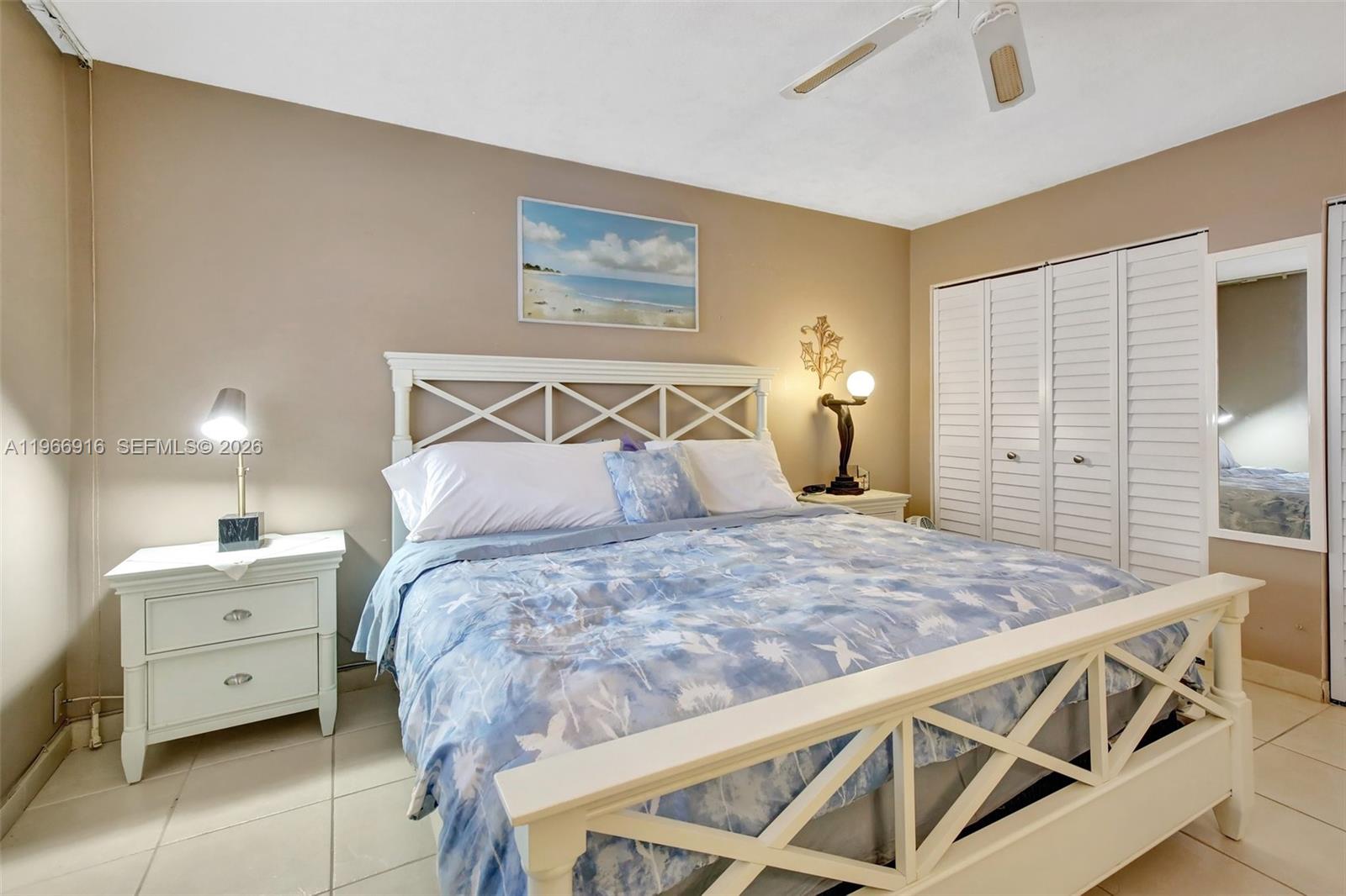 5300 Washington Street, Unit G127 Hollywood, FL 33021 - Photo 19 of 39 a bed sitting in a bedroom and table