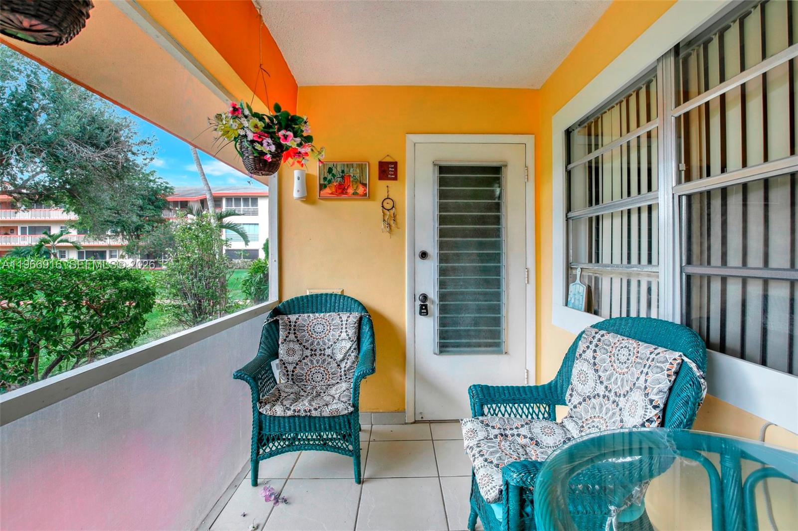 5300 Washington Street, Unit G127 Hollywood, FL 33021 - Photo 23 of 39 a outdoor living room with furniture