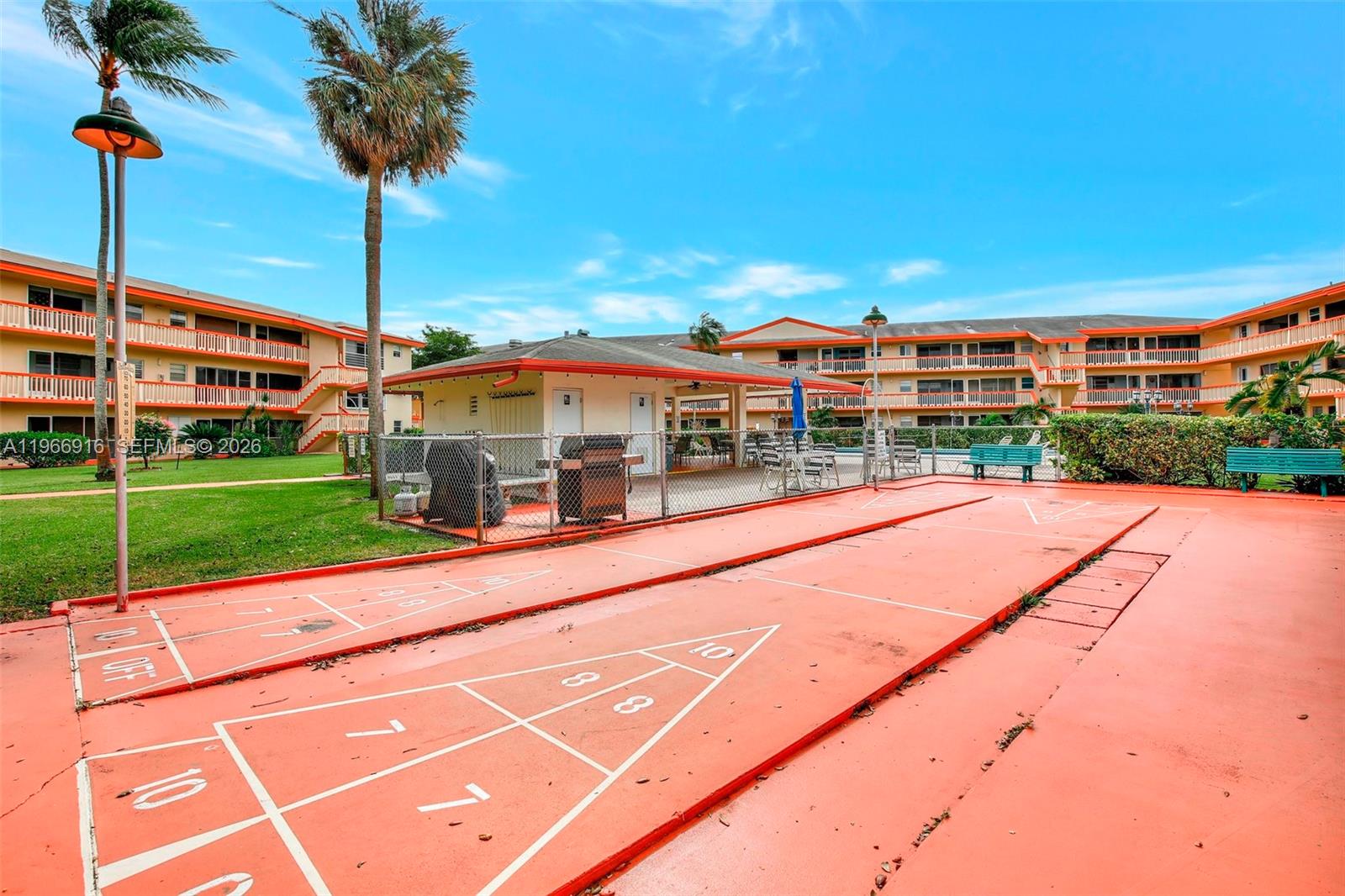 5300 Washington Street, Unit G127 Hollywood, FL 33021 - Photo 24 of 39 a view of a building with a yard and potted plants