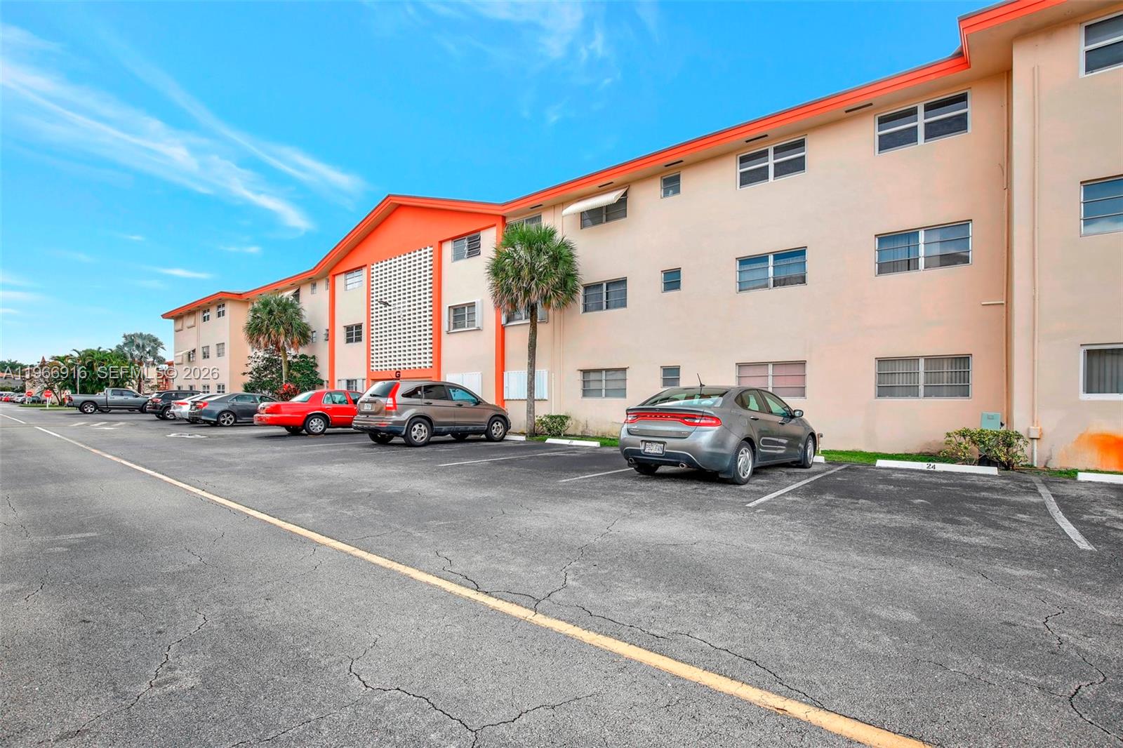 5300 Washington Street, Unit G127 Hollywood, FL 33021 - Photo 29 of 39 a car parked in front of a white house