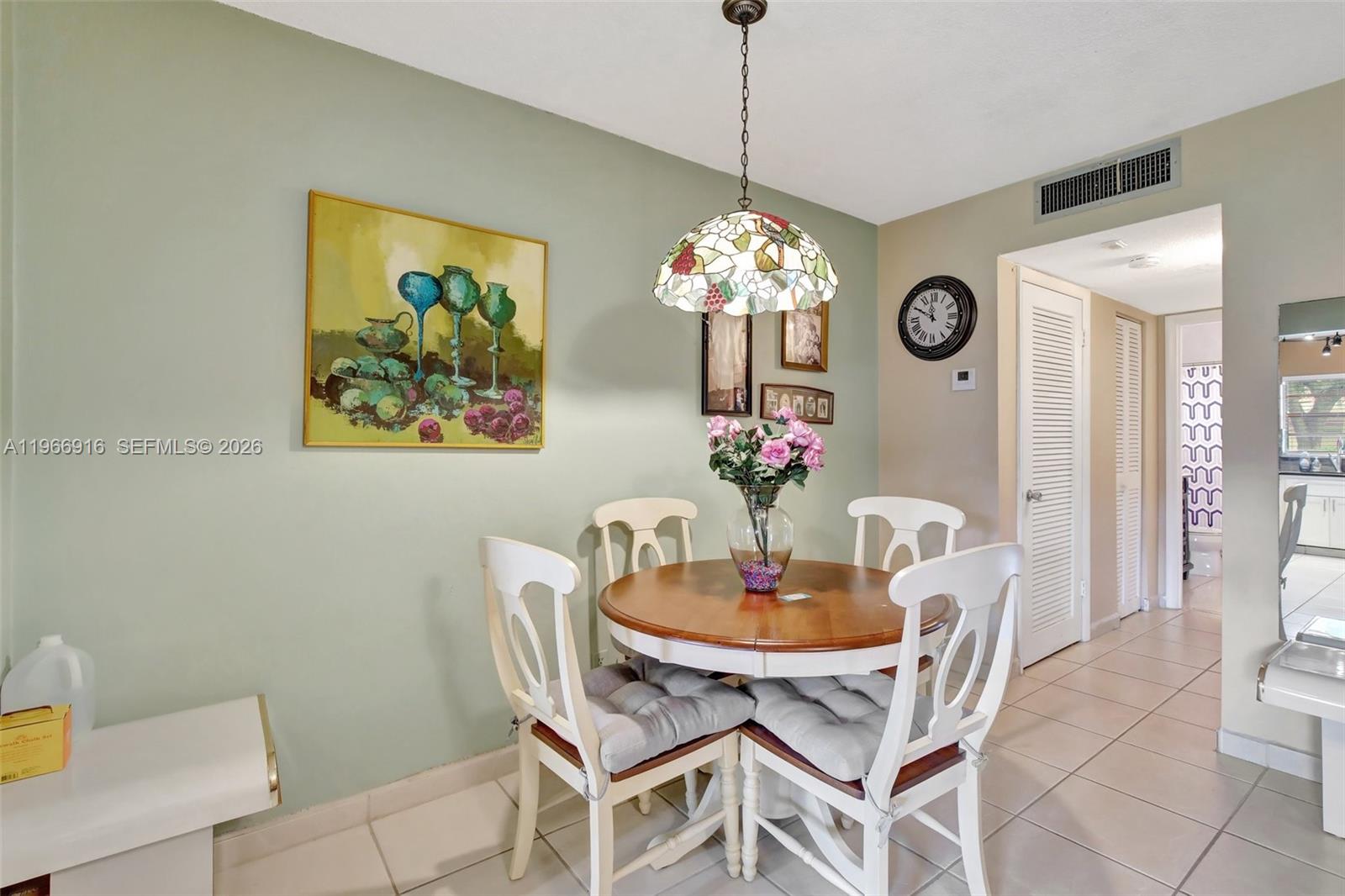 5300 Washington Street, Unit G127 Hollywood, FL 33021 - Photo 6 of 39 a dining room with furniture and chandelier